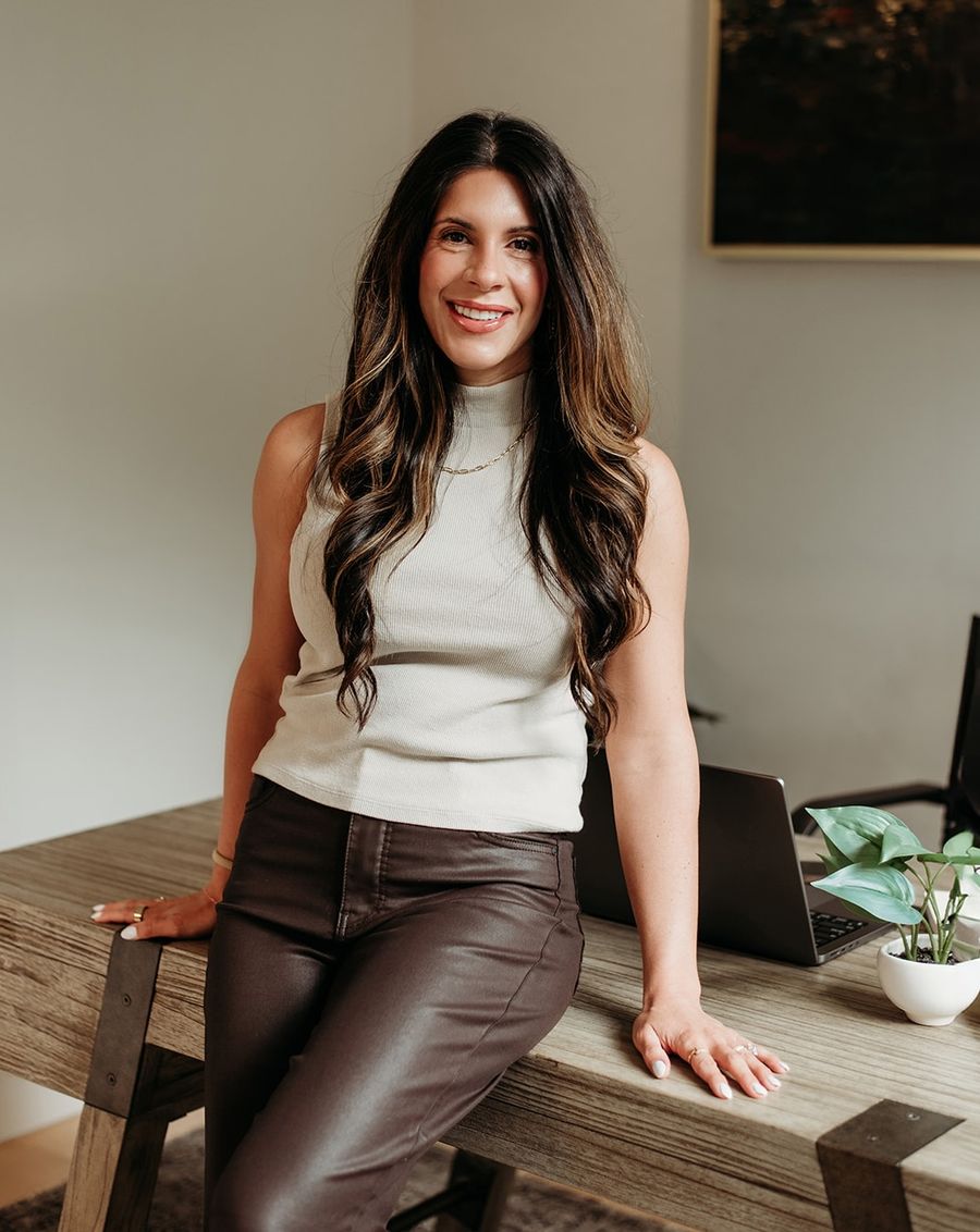 Melanie Mathews, founder of Ivory Balance Books, at her desk in South Jordan